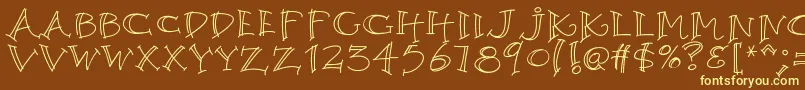 K26argento-fontti – keltaiset fontit ruskealla taustalla