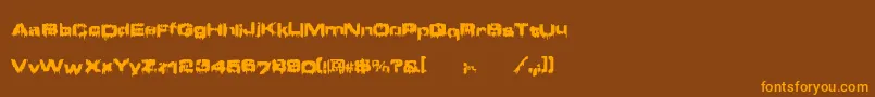 フォントBrain ffy – オレンジ色の文字が茶色の背景にあります。