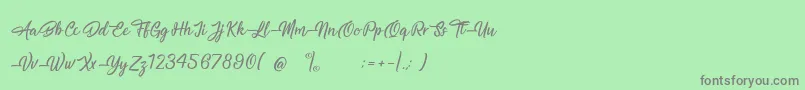 フォントMagnificentSupernatural – 緑の背景に灰色の文字
