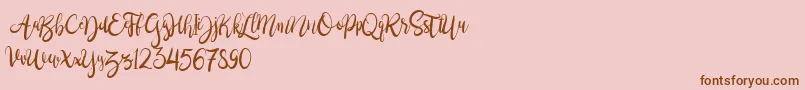 BrushgyoPersonalUse-Schriftart – Braune Schriften auf rosa Hintergrund