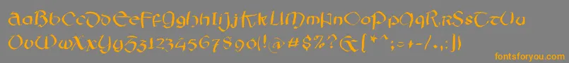 フォントIrishsketchesfs – オレンジの文字は灰色の背景にあります。