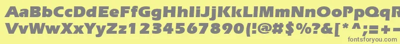 Evrsu-Schriftart – Graue Schriften auf gelbem Hintergrund