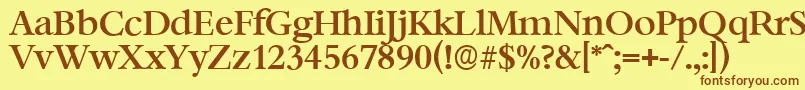 フォントBernsteinserialMediumRegular – 茶色の文字が黄色の背景にあります。