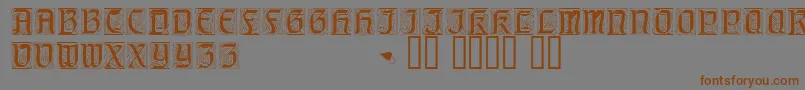 フォントGeniocapsssk – 茶色の文字が灰色の背景にあります。