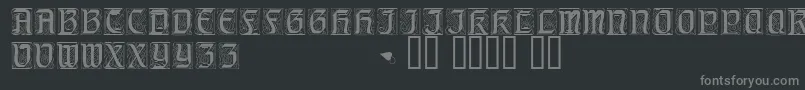 Fonte Geniocapsssk – fontes cinzas em um fundo preto
