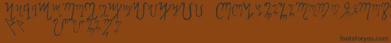 Więcej informacji o czcionce ThebanAlphabet Czcionka ThebanAlphabet – czarne czcionki na brązowym tle