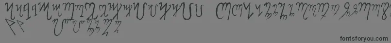 ThebanAlphabet-Schriftart – Schwarze Schriften auf grauem Hintergrund