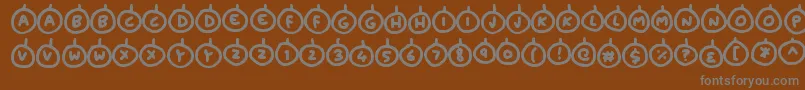 Шрифт Baubles – серые шрифты на коричневом фоне