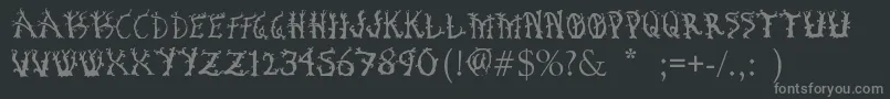 フォントBosqueEncantado – 黒い背景に灰色の文字