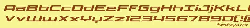 フォントPhoenicialowercaseexpandital – 茶色の文字が黄色の背景にあります。