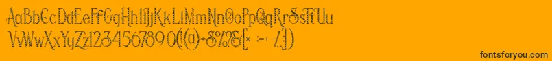 Czcionka Savanainlinegridgrunge – czarne czcionki na pomarańczowym tle