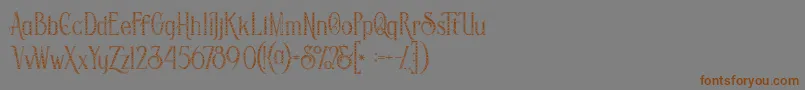 フォントSavanainlinegridgrunge – 茶色の文字が灰色の背景にあります。