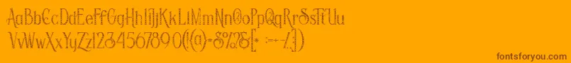 Czcionka Savanainlinegridgrunge – brązowe czcionki na pomarańczowym tle