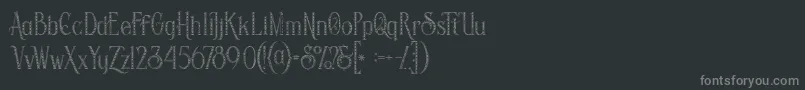 Savanainlinegridgrunge-fontti – harmaat kirjasimet mustalla taustalla