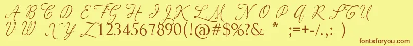 AdiosScriptCapsIi-fontti – ruskeat fontit keltaisella taustalla