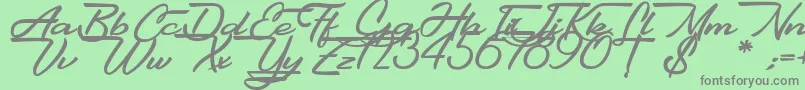 Gentlemanly-fontti – harmaat kirjasimet vihreällä taustalla