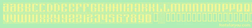 フォントComputeramok – 黄色の文字が緑の背景にあります