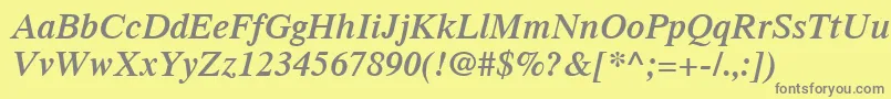 TimesLtSemiboldItalic-fontti – harmaat kirjasimet keltaisella taustalla
