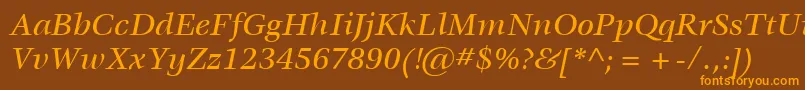フォントItcVeljovicLtMediumItalic – オレンジ色の文字が茶色の背景にあります。