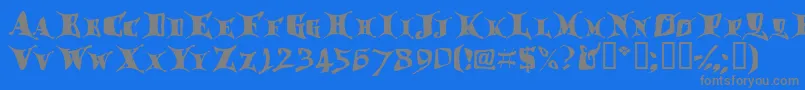 フォントDraggletail – 青い背景に灰色の文字