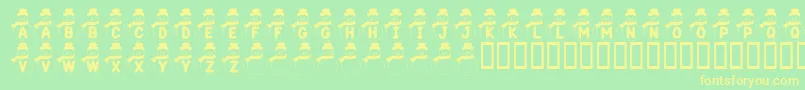 KrSnowman-Schriftart – Gelbe Schriften auf grünem Hintergrund