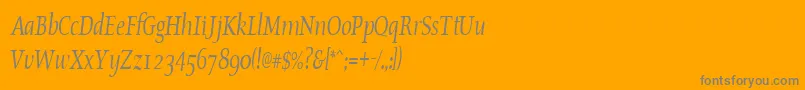 OldstylecondensedItalic-fontti – harmaat kirjasimet oranssilla taustalla