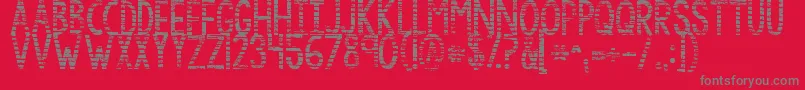 Kgbythegraceofgod-fontti – harmaat kirjasimet punaisella taustalla