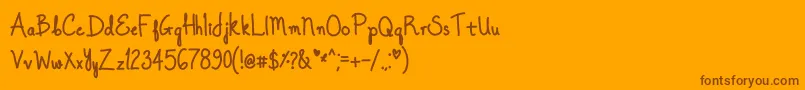 OnceUponADreamBold-Schriftart – Braune Schriften auf orangefarbenem Hintergrund
