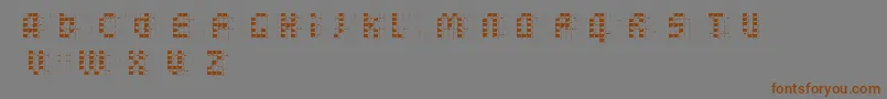 フォントBleuckReversedDker – 茶色の文字が灰色の背景にあります。
