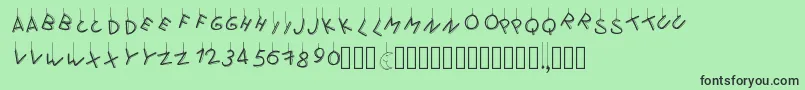 フォントPwflymetothemoon – 緑の背景に黒い文字