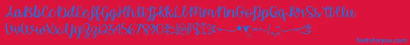 Czcionka UnicornCalligraphyTtf – niebieskie czcionki na czerwonym tle