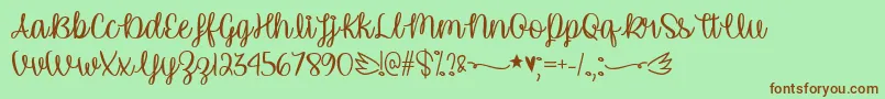 Fonte UnicornCalligraphyTtf – fontes marrons em um fundo verde