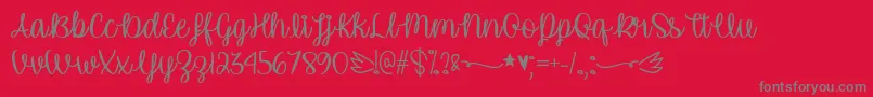 UnicornCalligraphyTtf-fontti – harmaat kirjasimet punaisella taustalla
