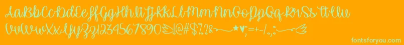 UnicornCalligraphyTtf-Schriftart – Grüne Schriften auf orangefarbenem Hintergrund