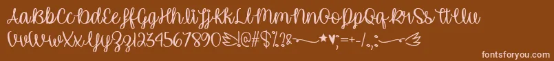 Więcej informacji o czcionce UnicornCalligraphyTtf Czcionka UnicornCalligraphyTtf – różowe czcionki na brązowym tle