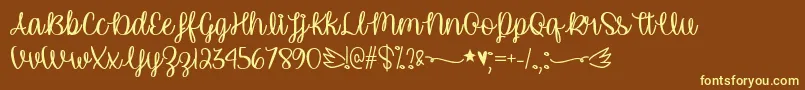 UnicornCalligraphyTtf-fontti – keltaiset fontit ruskealla taustalla