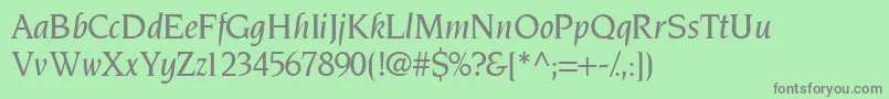 TridentmediumsskItalic-fontti – harmaat kirjasimet vihreällä taustalla