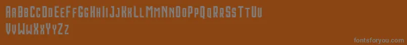HoustonDoubleDemo-fontti – harmaat kirjasimet ruskealla taustalla
