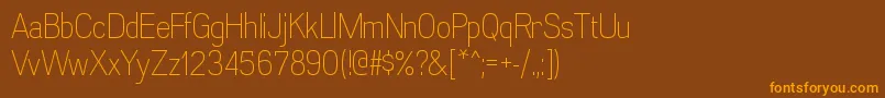 AkazanltRegular-Schriftart – Orangefarbene Schriften auf braunem Hintergrund