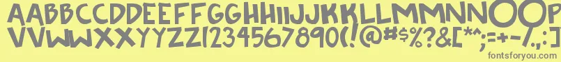 フォントKneeToTheFace – 黄色の背景に灰色の文字