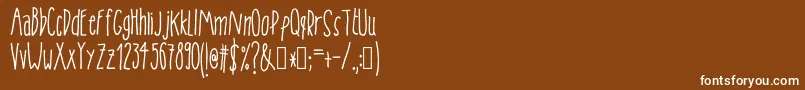fuente Tanaestelskinnyhandmade01Regular – Fuentes Blancas Sobre Fondo Marrón