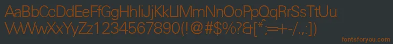 フォントUniversallgtdbNormal – 黒い背景に茶色のフォント