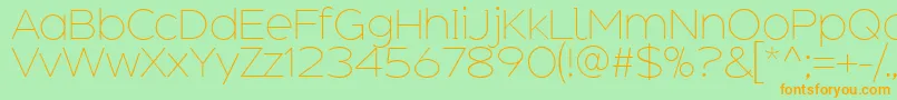 AdequateExtralight Font – Orange Fonts on Green Background