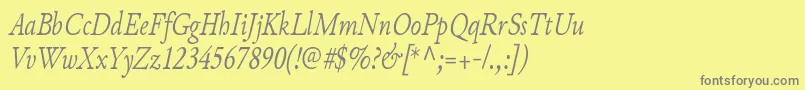 フォントJunicodeItaliccondensed – 黄色の背景に灰色の文字