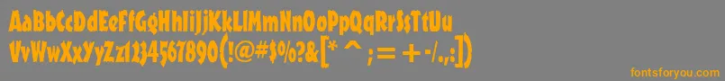 フォントOutbackitcTt – オレンジの文字は灰色の背景にあります。