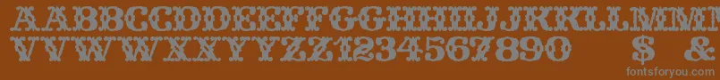 フォントWildWestWind – 茶色の背景に灰色の文字
