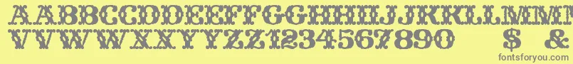 フォントWildWestWind – 黄色の背景に灰色の文字