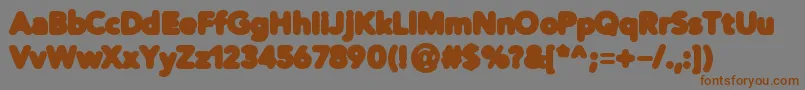 フォントDistroBlack – 茶色の文字が灰色の背景にあります。
