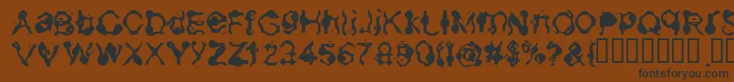 Aneurysm-Schriftart – Schwarze Schriften auf braunem Hintergrund