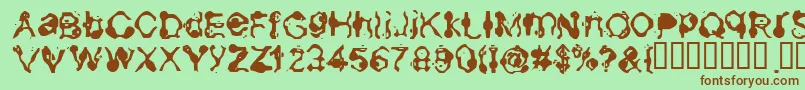 Aneurysm-Schriftart – Braune Schriften auf grünem Hintergrund